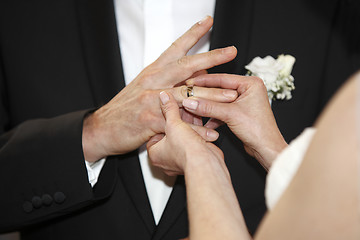 Image showing Hands of a bride and groom