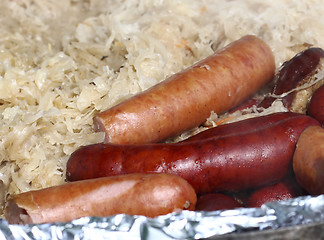 Image showing Fried sausage with stewed cabbage