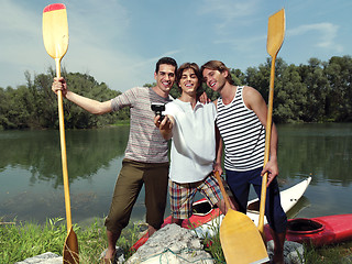 Image showing men with canoe in nature io