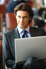 Image showing businessman sitting in the airport b