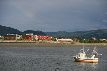 Image showing Fishing boat and shore