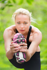 Image showing Lady practicing yoga in the nature.