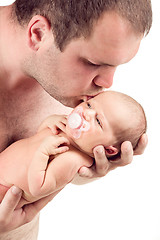 Image showing Loving father kissing his baby