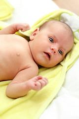 Image showing infant wrapped in a towel after bath