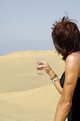 Image showing Woman, water and desert