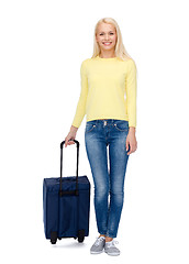Image showing smiling young woman with suitcase