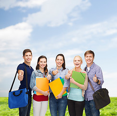 Image showing group of smiling students showing thumbs up