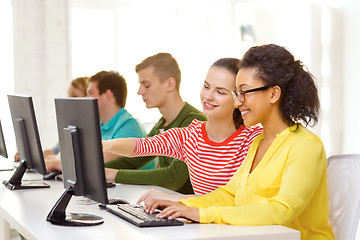 Image showing smiling students in computer class at school