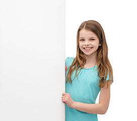 Image showing happy little girl with blank white board