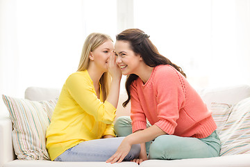 Image showing one girl telling another secret