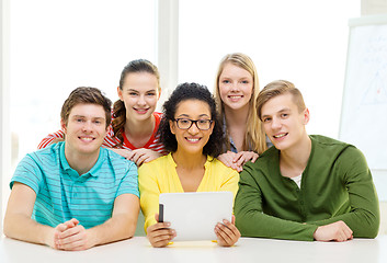 Image showing smiling students with tablet pc computer at school