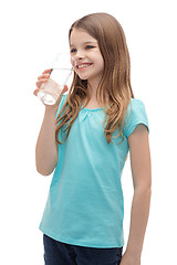 Image showing smiling little girl with glass of water