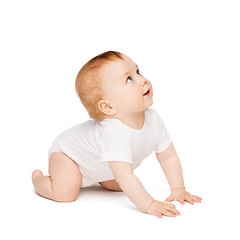 Image showing crawling curious baby looking up