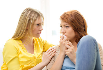 Image showing one teenage girl comforting another after break up