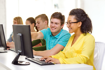 Image showing smiling students in computer class at school