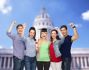 Image showing group of standing smiling students with diploma