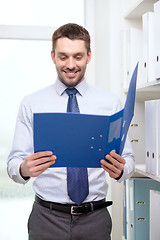 Image showing businessman with folder at office