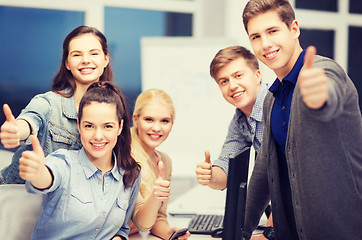 Image showing students with computer monitor and smartphones