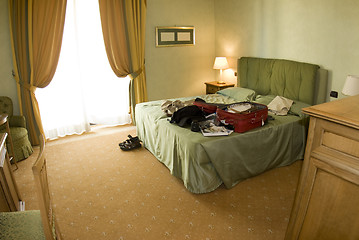 Image showing hotel suite with open suitcase
