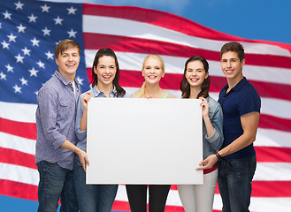 Image showing group of standing students with blank white board