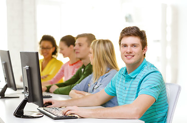 Image showing male student with classmates in computer class