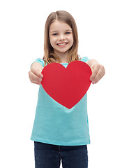 Image showing smiling little girl giving red heart