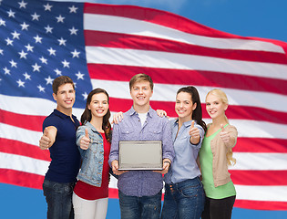 Image showing smiling students with laptop computer