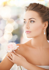 Image showing young woman with rose flower