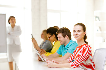 Image showing female student with classmates in computer class