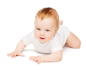 Image showing smiling baby lying on floor