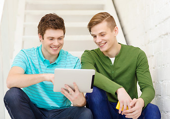 Image showing smiling male students with tablet pc computer