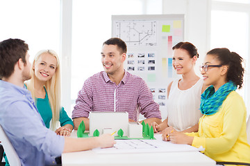 Image showing smiling architects working in office