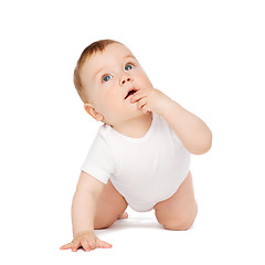 Image showing crawling curious baby looking up