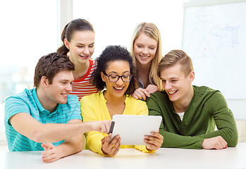 Image showing smiling students with tablet pc computer at school