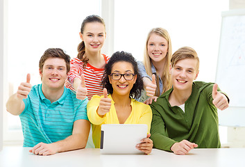 Image showing smiling students with tablet pc computer at school