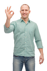 Image showing smiling man showing ok-sign