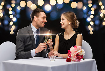 Image showing couple with glasses of champagne at restaurant