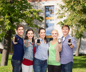 Image showing students showing blank smartphones screens