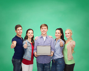 Image showing smiling students with laptop computer