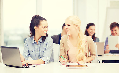 Image showing students with laptop, tablet pc and notebooks