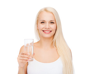 Image showing young smiling woman with glass of water