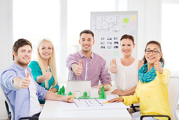 Image showing smiling architects working in office