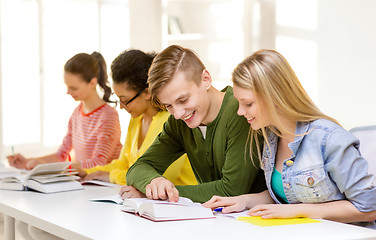 Image showing students with textbooks and books at school