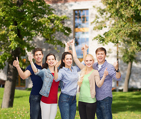 Image showing group of smiling students showing thumbs up