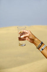 Image showing Hand reaching for water.