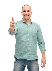 Image showing smiling man showing thumbs up