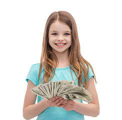 Image showing smiling little girl with dollar cash money