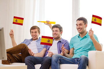 Image showing happy male friends with flags and vuvuzela