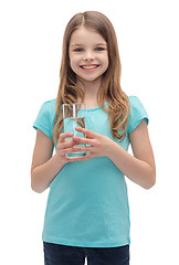 Image showing smiling little girl with glass of water