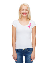 Image showing smiling woman with pink cancer awareness ribbon